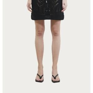NEW GOEN.J crochet knit mini skirt in black
